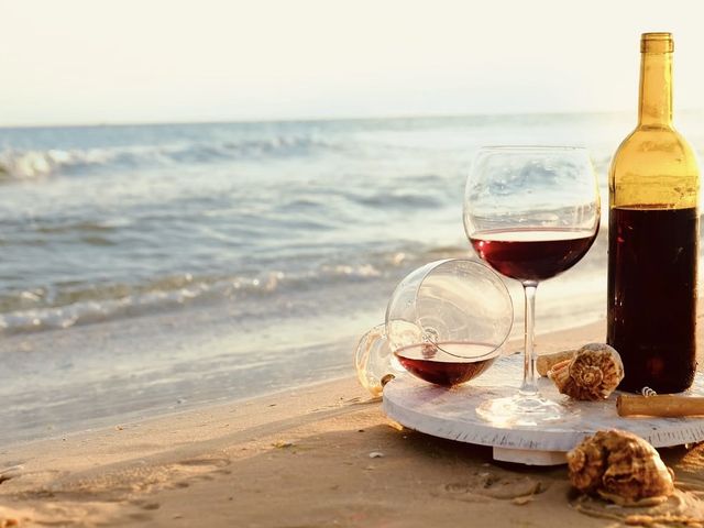 Wine on the beach at sunset — Cabo Travel Boutique